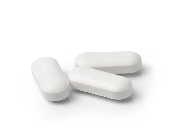 Медичні таблетки таблетки ізольовані на білому тлі — стокове фото
