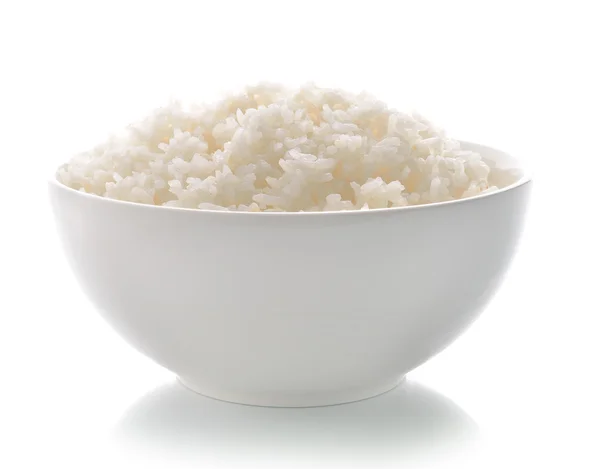 Ρύζι σε ένα μπολ σε λευκό φόντο — Φωτογραφία Αρχείου