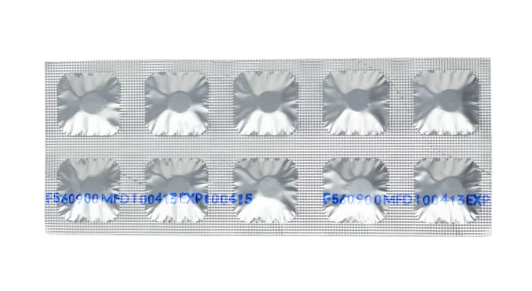 Conjunto de pastillas en un blister de papel de aluminio —  Fotos de Stock