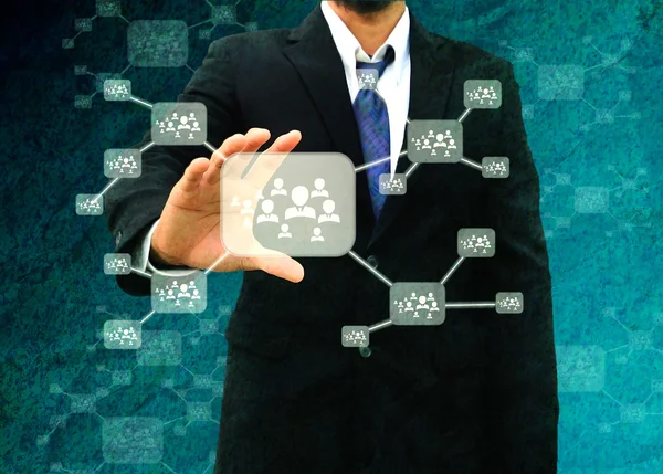 Businessman holding icon of social network — Stock Photo, Image