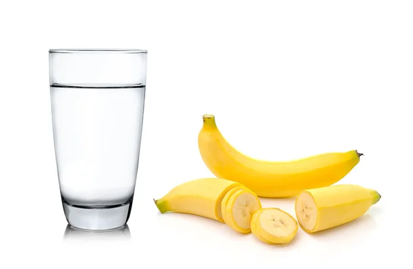 Glass of water and banana — Stock Photo, Image