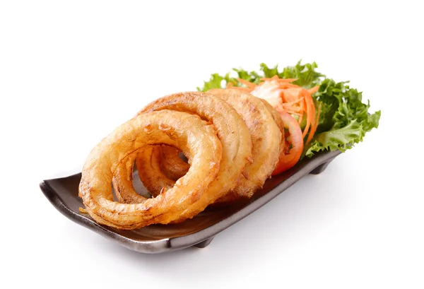 Onion rings on a plate on white background — Stock Photo, Image