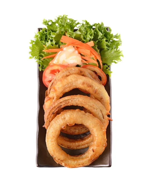 Onion rings on a plate on white background — Stock Photo, Image