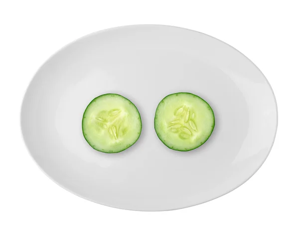 Cucumber in the white plate isolated on white background — Stock Photo, Image