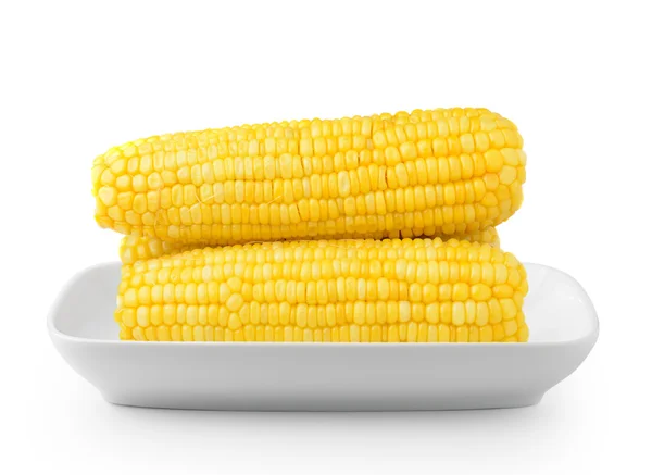 Кукурудза на білій тарілці ізольована на білому фоні — стокове фото