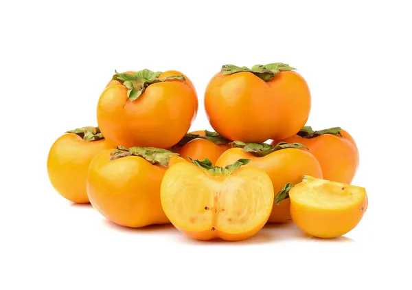 Rijpe persimmons geïsoleerd op witte achtergrond — Stockfoto