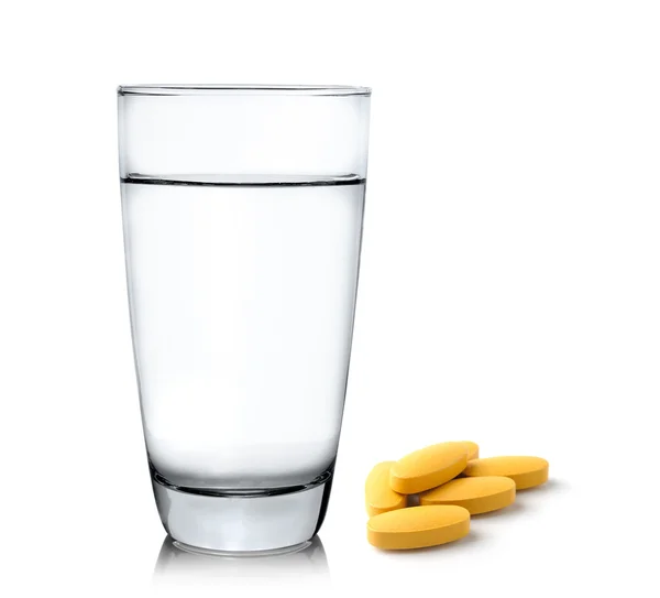 Glass of water and pills isolated on white background — Stock Photo, Image