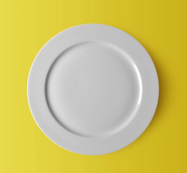 Sarı zemin üzerinde beyaz seramik plaka