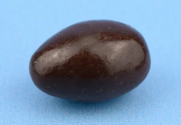Close View Chocolate Glazed Nut Isolated Light Blue Background — Zdjęcie stockowe