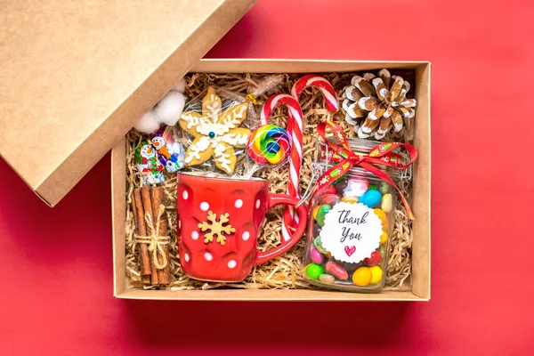 Handmade care package, seasonal gift box with candies, gingerbread, xmas decor Personalized eco friendly basket for family, friends, girl for thanksgiving, Christmas, mothers, fathers day Flat lay.