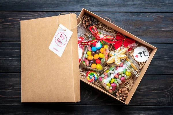 Handmade care package, seasonal gift box with candies, gingerbread, xmas decor Personalized eco friendly basket for family, friends, girl for thanksgiving, Christmas, mothers, fathers day Flat lay.