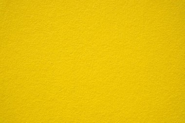 Sarı alçı duvar dokusu arkaplanı.