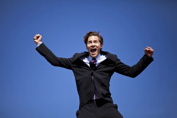 Excited businessman jumping — Stock Photo, Image