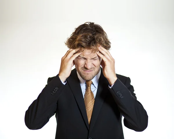 Suffering businessman with migraine — Stock Photo, Image