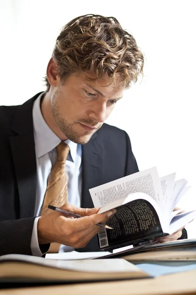 Businessman looking at papers — Stock Photo, Image