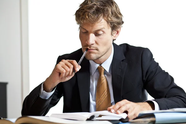 Businessman trying to figure out the work — Stock Photo, Image