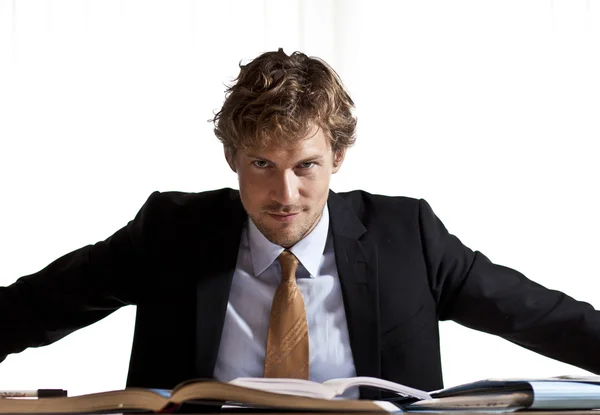 Focused businessman sitting at desk — Stock Photo, Image