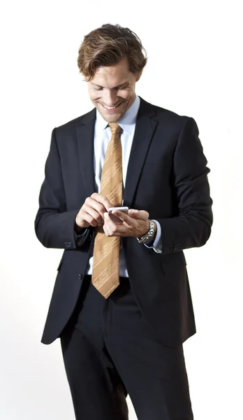 Happy businessman texting — Stock Photo, Image