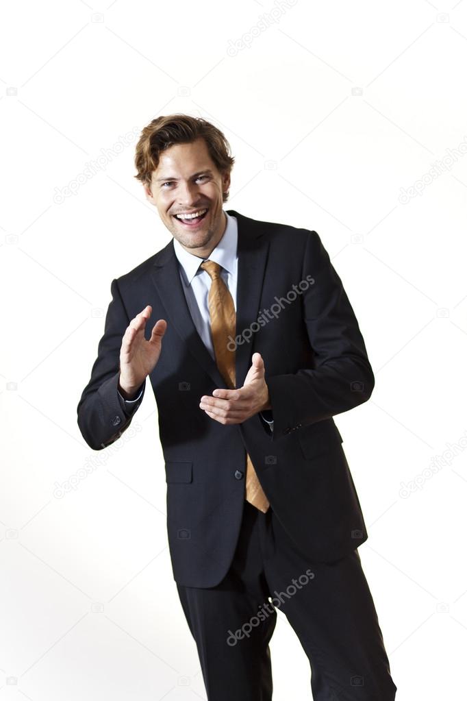 Laughing businessman clapping his hands