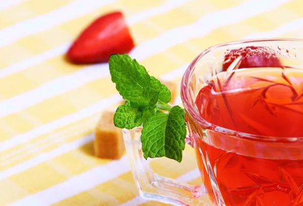 Fresh red tea and tasty fruit with mint — Stock Photo, Image