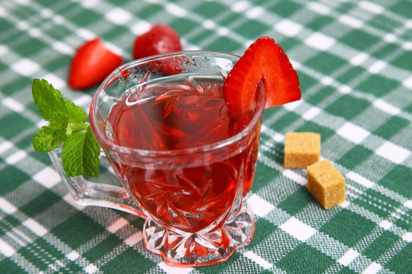 Fresh red tea and tasty fruit with mint — Stock Photo, Image