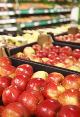 Appetizing red apple in supermarket