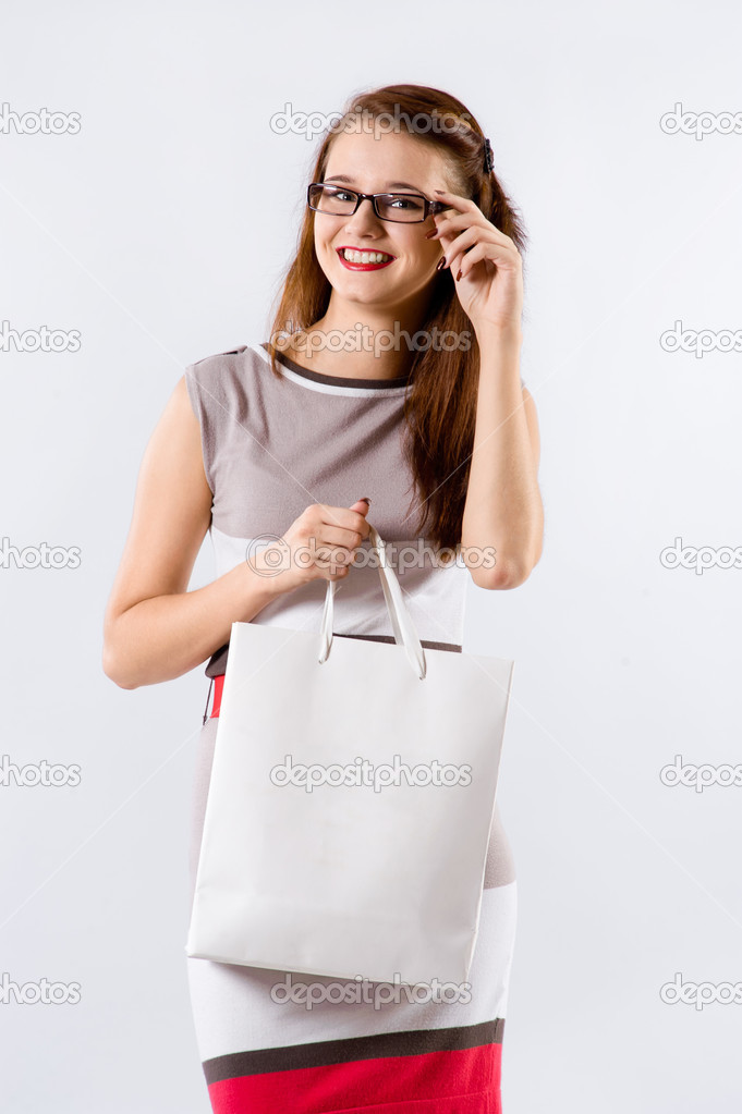 woman holding shopping white bag