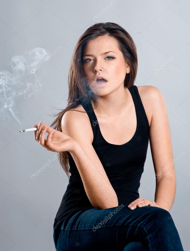 Beautiful girl smoking a cigarette Stock Photo by ©format35 32124461