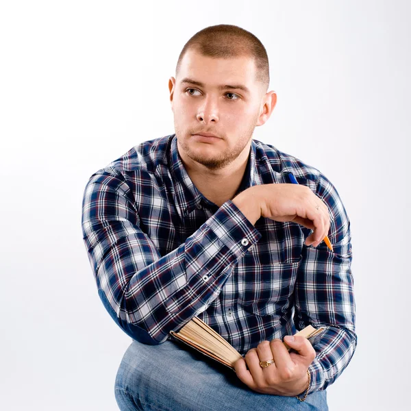 Thoughtful man wearing checkered shirt — Stock Photo, Image