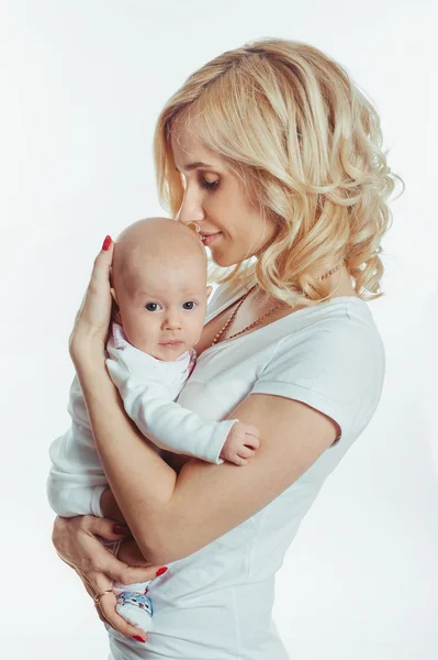 Young mother with a charming baby Stock Picture