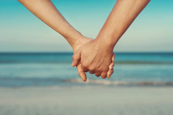 Lovers couple holding hands — Stock Photo, Image