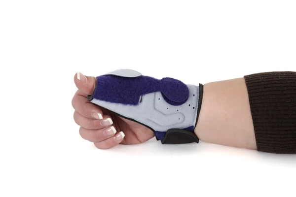 Wrist orthosis shown on a woman's hand. — Stock Photo, Image