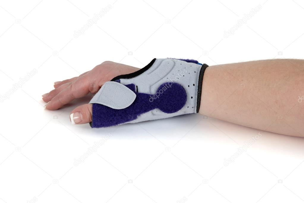 Wrist orthosis shown on a woman's hand.