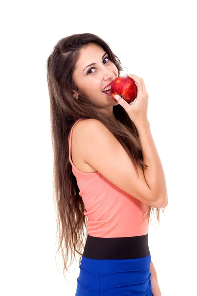 Sexy morena jovem mulher comer maçã vermelha . — Fotografia de Stock