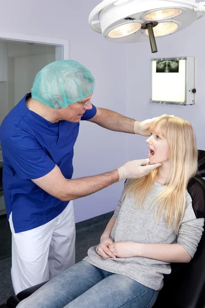 Woman being examined by a Dental-Surgeon. — Stock Photo, Image