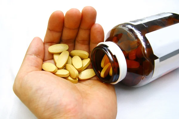Pills, medication at hand — Stock Photo, Image