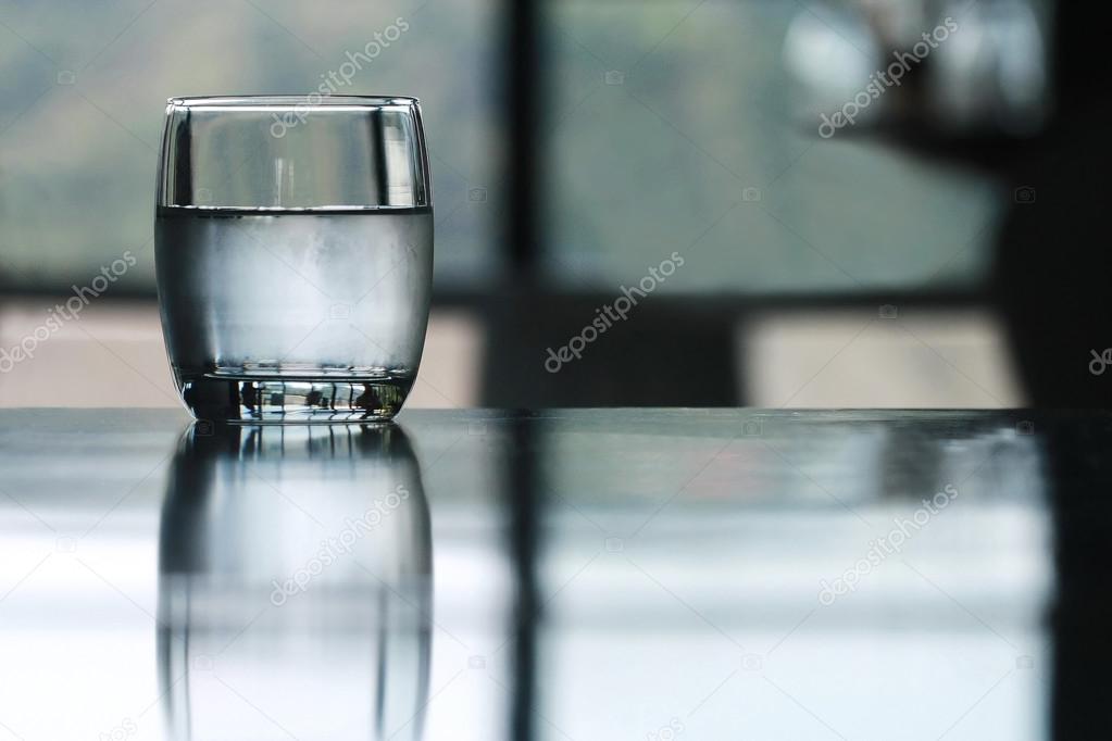 cold drinking water glass on table