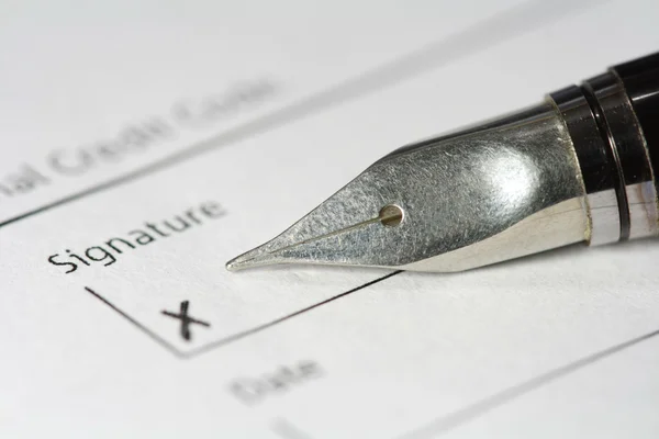 Metal fountain pen on signature paper — Stock Photo, Image