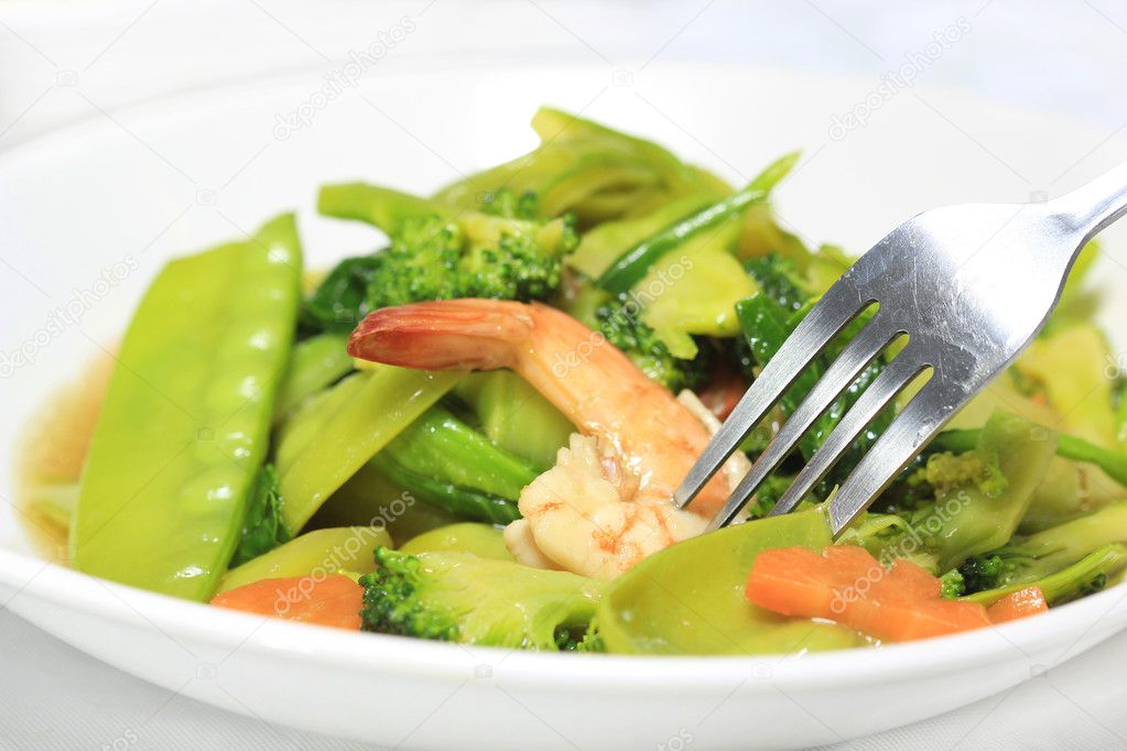 Stir-fried vegetables with fork