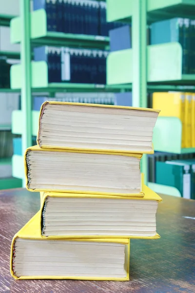 Yellow book stack on table — Stock Photo, Image