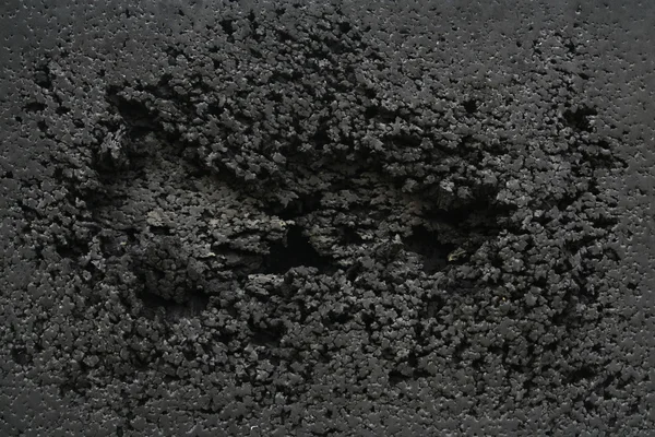 Černý gumový poškozené pozadí, pozadí abstraktní — Stock fotografie