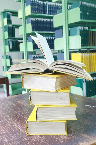 Book open on books stack — Stock Photo, Image