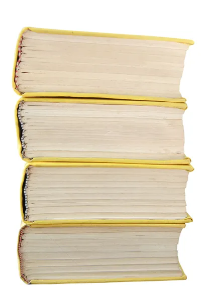 Изолированная стопка жёлтых книг — стоковое фото