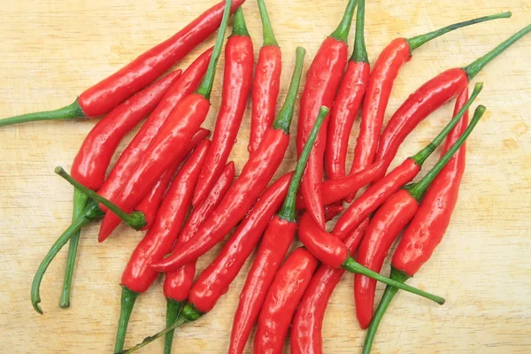 Red chili on wood board — Stock Photo, Image