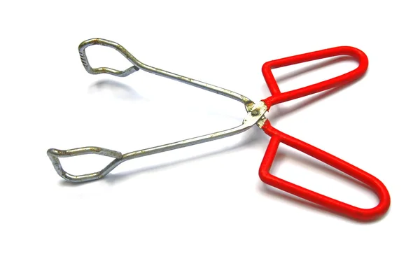 Red barbeque tongs isolated — Stock Photo, Image
