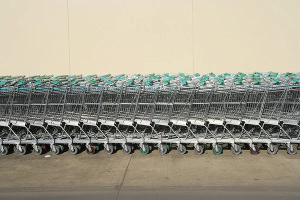 Shopping carts in a row — Stock Photo, Image
