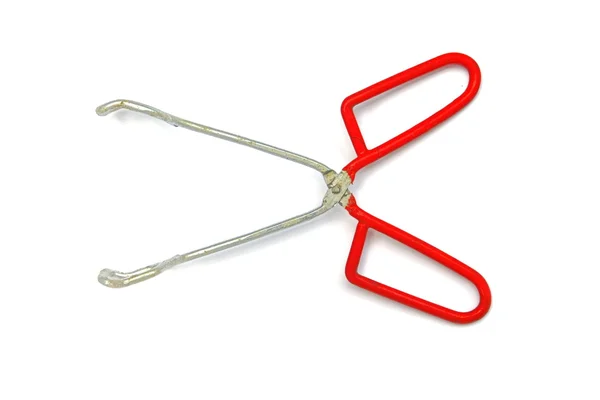 Red barbeque tongs isolated — Stock Photo, Image