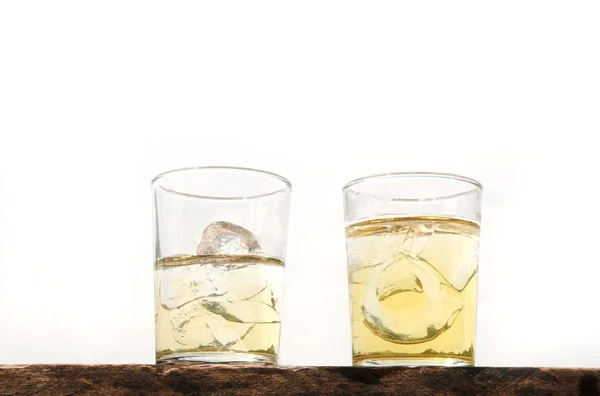 Two lager beer with ice glass on wood isolated — Stock Photo, Image