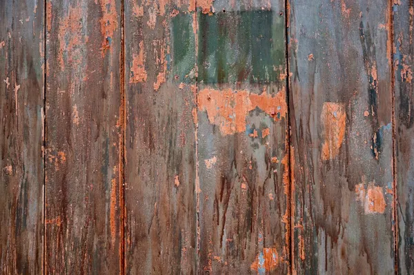 Peeling paint on grunge wooden surface — Stock Photo, Image