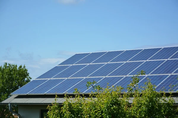 Solar energy panels on roof of house — Stock Photo, Image